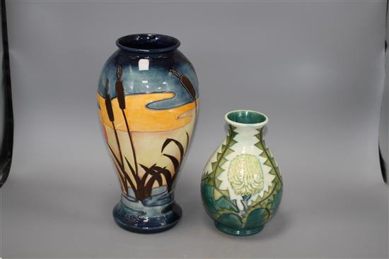 Two modern Moorcroft vases, one decorated with bulrushes and sunset, height 31cm, the other with stylised dandelions, height 19cm